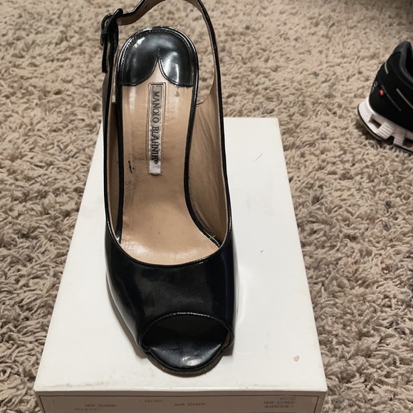Beautiful Manolo Blahnik Black patent leather sling backs.